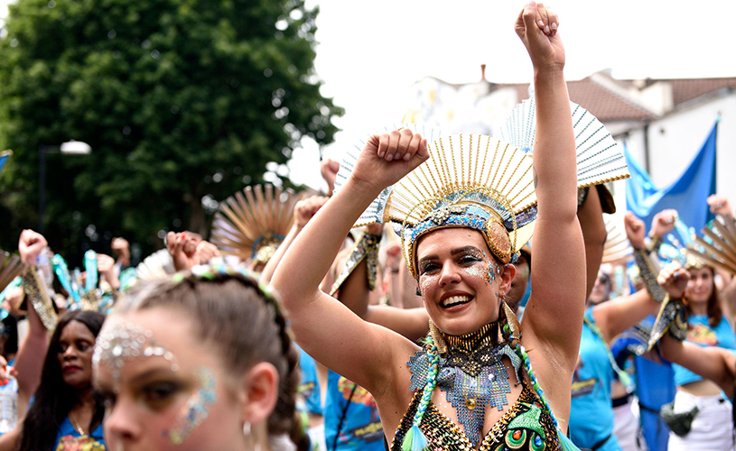 Woman in carnival costume dancing at St Pauls Carnival